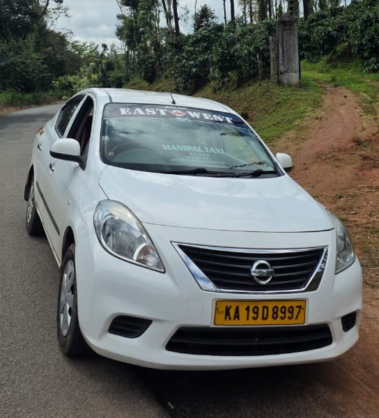 Nissan Sunny sedan taxi for Manipal local rides and airport transfers